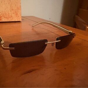Tag Heuer Sunglasses with Brown Lenses and Gold Frame